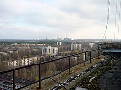 The Ukrainian city of Pripyat abandoned due to a nuclear accident, which took place at Chernobyl Nuclear Power Plant on 26 April 1986, seen in the background.
