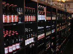 Bottles of beer and glassware at a beer shop