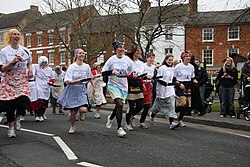 A pancake race in Olney, England