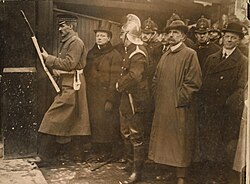 Churchill (second left) photographed at the Siege of Sidney Street
