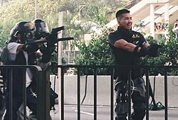 Hong Kong Police Force officers aiming firearms at protestors in Wong Tai Sin District during the 2019–2020 Hong Kong protests