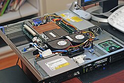 The inside and front of a Dell PowerEdge web server, a computer designed for rack mounting