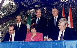 U.S. President Bush, Canadian PM Mulroney, and Mexican President Salinas participate in the ceremonies to sign the North American Free Trade Agreement (NAFTA).