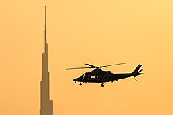 Dubai Police Agusta A-109K-2 in flight near Burj Khalifa