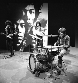 The Jimi Hendrix Experience, a power trio, performing for Dutch television in 1967: From left to right: singer-guitarist Jimi Hendrix, bassist Noel Redding, and drummer Mitch Mitchell