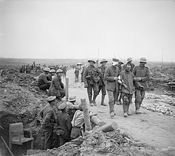 British gunners watching German prisoners passing after the taking of Guillemont, 3 September 1916