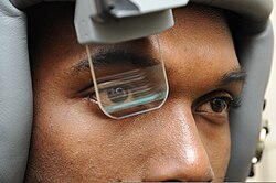 U.S. Air Force flight equipment technician testing a Scorpion helmet mounted integrated targeting system