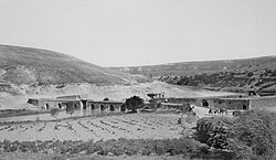 Motor car crossing the bridge over the Orontes River at Er Rastan