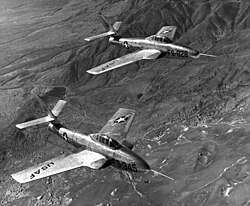 YF-84F and YRF-84F prototypes in 1952. Note the early style wing root jet intakes, which were eventually only retained on the RF-84F, due to the need to fit cameras in the nose. The standard F-84F reverted to the original nose intake due to a loss of thrust from the wing root intakes.