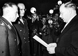 Generals Adolf Heusinger and Hans Speidel being sworn into the newly founded Bundeswehr by Theodor Blank on 12 November 1955
