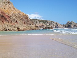 Cornwall is known for its beaches (Porthcurno Beach illustrated) and rugged coastline.